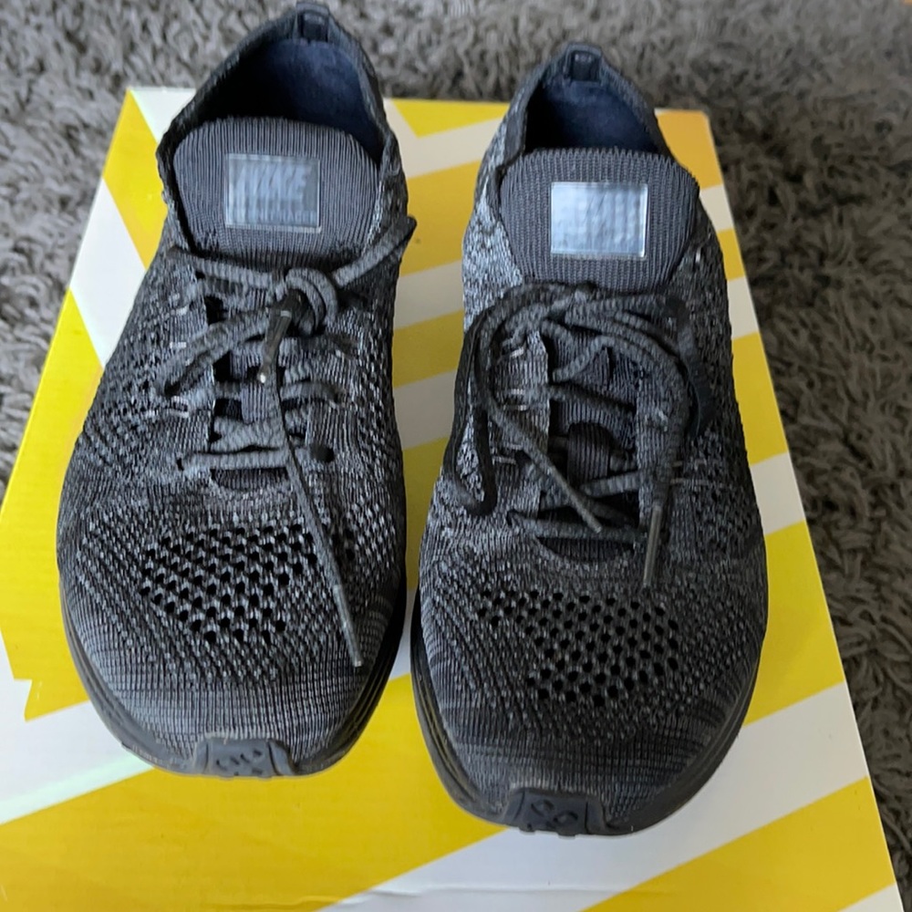 Triple black Nike Racer